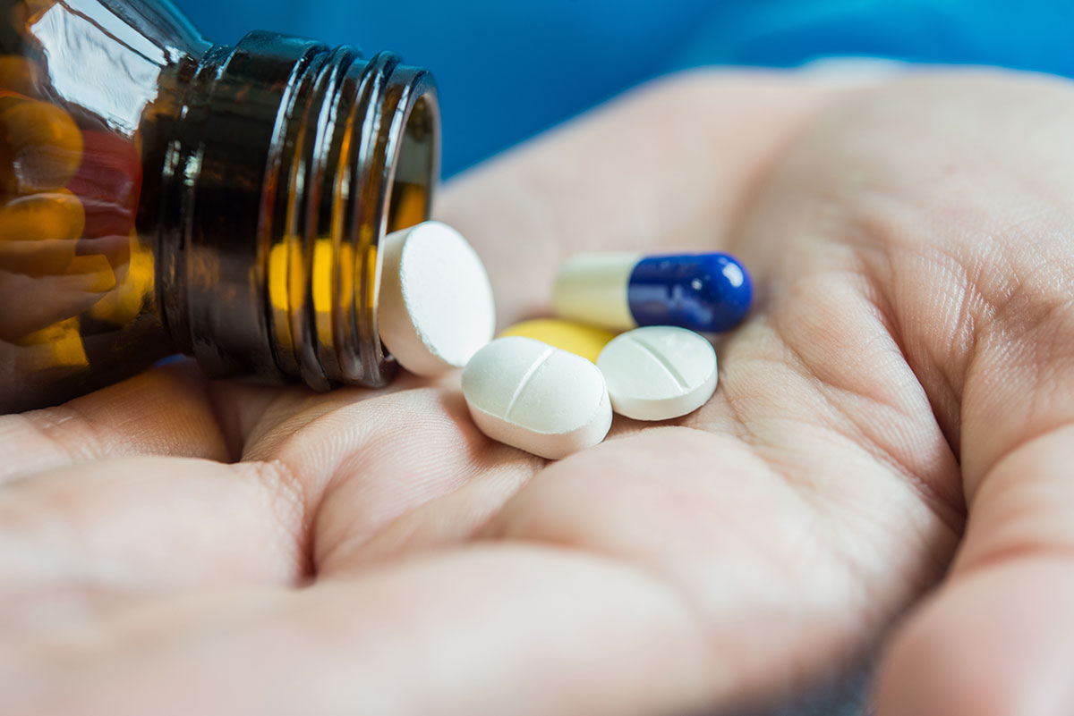 pouring out medicine prescription pills